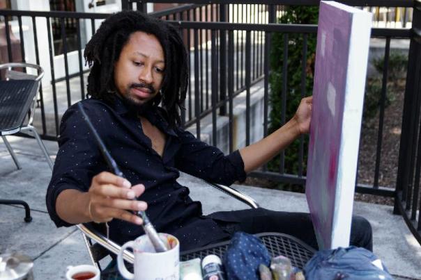 Genesis the Greykids creates art on canvas