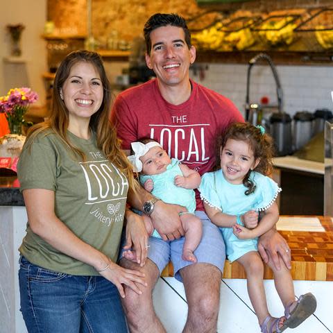 Luis Conteras, Gisela Bellina and family inside their store, The Local Juice