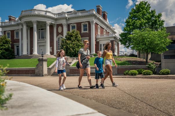 Family Walking In Front Of Hunter Museum of American Art