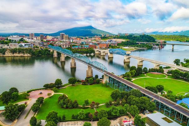 Aerial of Coolidge Park, bridges, and downtown Chattanooga Riverfront in Summer