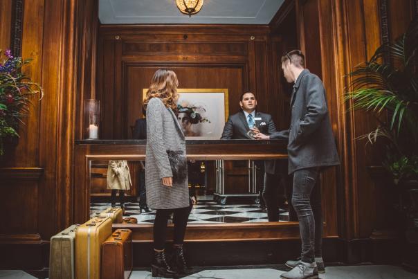 couple checks in at front desk of the Read House