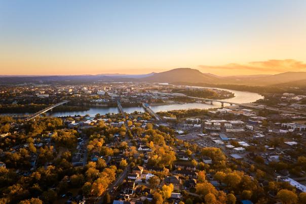 aerial view of downtown and north chattanooga at sunrise with the river and mountains