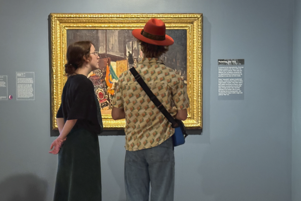 people look at art in gilded frame at Hunter Art Museum